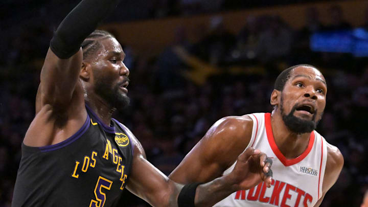 Apr 21, 2026; Los Angeles, California, USA; Houston Rockets forward Kevin Durant (7) is defended by Los Angeles Lakers center Deandre Ayton (5) as he drives to the basket during the second half of game two of the first round of the 2026 NBA Playoffs at Crypto.com Arena. Mandatory Credit: Jayne Kamin-Oncea-Imagn Images