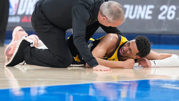 Jun 22, 2025; Oklahoma City, Oklahoma, USA; Indiana Pacers guard Tyrese Haliburton (0) reacts after suffering an injury during the first quarter against the Oklahoma City Thunder during game seven of the 2025 NBA Finals at Paycom Center. Mandatory Credit: Kyle Terada-Imagn Images