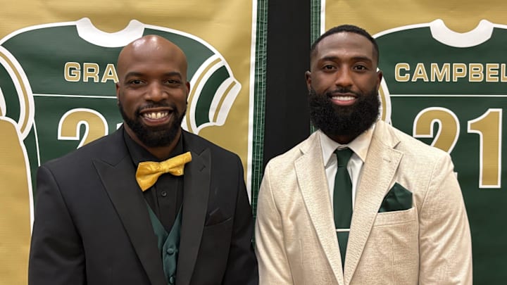 Doran Grant, left, and Parris Campbell had their No. 21 football jerseys retired by St. Vincent-St. Mary High School during a ceremony on June 19, 2025, at the LeBron James Arena in Akron, Ohio.