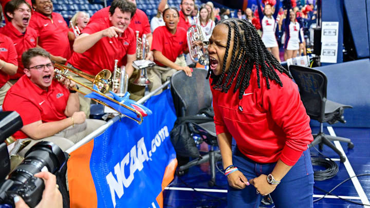 Mar 23, 2024; South Bend, Indiana, USA; Ole Miss Rebels head coach Yolett McPhee-McCuin celebrates with the Ole Miss band after defeating the Marquette Golden Eagles 67-55 in the first round of the NCAA Tournament at the Purcell Pavilion. Mandatory Credit: Matt Cashore-Imagn Images Mar 23, 2024; South Bend, Indiana, USA; Ole Miss Rebels head coach Yolett McPhee-McCuin celebrates with the Ole Miss band after defeating the Marquette Golden Eagles 67-55 in the first round of the NCAA Tournament at the Purcell Pavilion. Mandatory Credit: Matt Cashore-Imagn Images