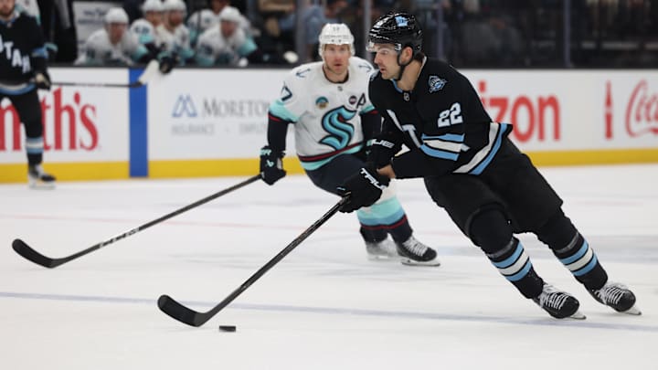 Apr 8, 2025; Salt Lake City, Utah, USA; Utah Hockey Club center Jack McBain (22) skates with the puck against the Seattle Kraken during the third period at Delta Center. Mandatory Credit: Rob Gray-Imagn Images