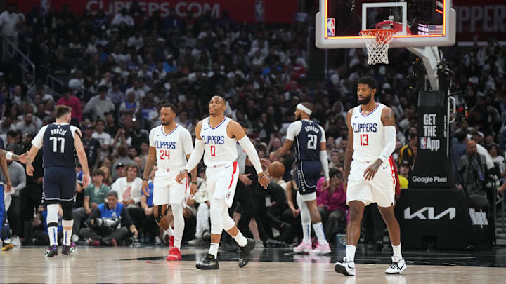 May 1, 2024; Los Angeles, California, USA; LA Clippers guard Norman Powell (24), guard Russell Westbrook (0) and forward Paul George (13) react at the end of the first half against the Dallas Mavericks during game five of the first round for the 2024 NBA playoffs at Crypto.com Arena. Mandatory Credit: Kirby Lee-Imagn Images May 1, 2024; Los Angeles, California, USA; LA Clippers guard Norman Powell (24), guard Russell Westbrook (0) and forward Paul George (13) react at the end of the first half against the Dallas Mavericks during game five of the first round for the 2024 NBA playoffs at Crypto.com Arena. Mandatory Credit: Kirby Lee-Imagn Images