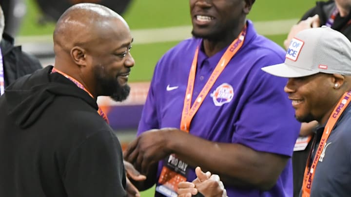 Mike Tomlin, left, Head Coach of the Pittsburgh Steelers, greets a man near Clemson defensive coach Nick Eason during Clemson FootballÕs 2025 Pro Day featured seven former football players, five showing speed and skills for NFL scouts before the draft April 24-26 in Green Bay.