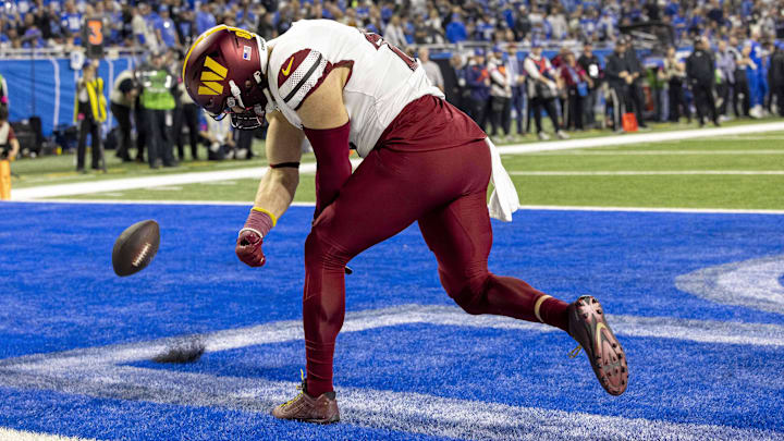 Jan 18, 2025; Detroit, Michigan, USA;  Washington Commanders tight end Zach Ertz (86) celebrates a touchdown during the second quarter against Detroit Lions at Ford Field. Mandatory Credit: David Reginek-Imagn Images