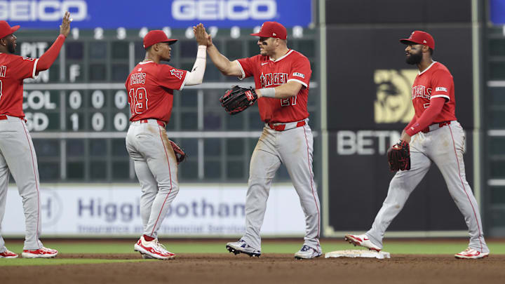 Apr 12, 2025; Houston, Texas, USA; Los Angeles Angels right fielder Mike Trout (27) celebrates with second baseman Kyren Paris (19) after the game against the Houston Astros at Daikin Park. Mandatory Credit: Troy Taormina-Imagn Images