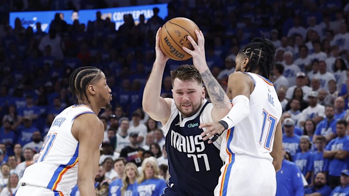 May 7, 2024; Oklahoma City, Oklahoma, USA; Dallas Mavericks guard Luka Doncic (77) drives between May 7, 2024; Oklahoma City, Oklahoma, USA; Dallas Mavericks guard Luka Doncic (77) drives between