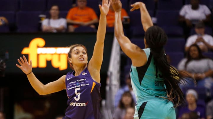 Mercury's  Leilani Mitchell (5) defends Liberty's Brittany Boyd (15) as she shoots during the first half at Talking Stick Resort Arena in Phoenix, Ariz. on Aug. 19, 2018. 

865709002