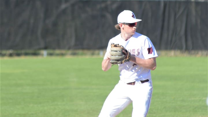 John Glenn shortstop Colt Emerson collects himself before making a throw to first base during Wednesday's 4-3 win over Indian Valley.

ZAN 02 JG BB