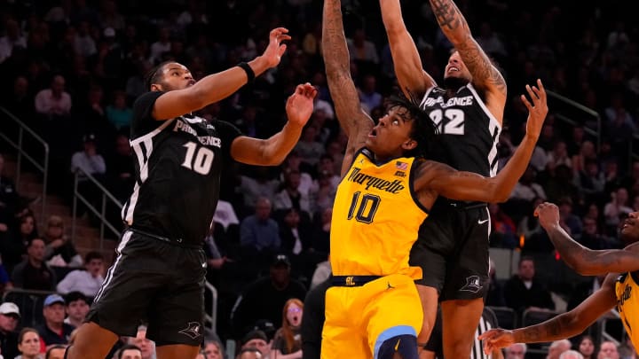 Mar 15, 2024; New York City, NY, USA;  Marquette Golden Eagles guard Zaide Lowery (10), Providence Friars forward Rich Barron (10) and guard Devin Carter (22) fight for a rebound during the second half at Madison Square Garden. Mandatory Credit: Robert Deutsch-USA TODAY Sports