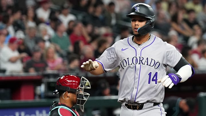 Mar 30, 2024; Phoenix, Arizona, USA; Colorado Rockies shortstop Ezequiel Tovar (14) crosses home plate after hitting a two-run home run off Tommy Henry in the second inning.