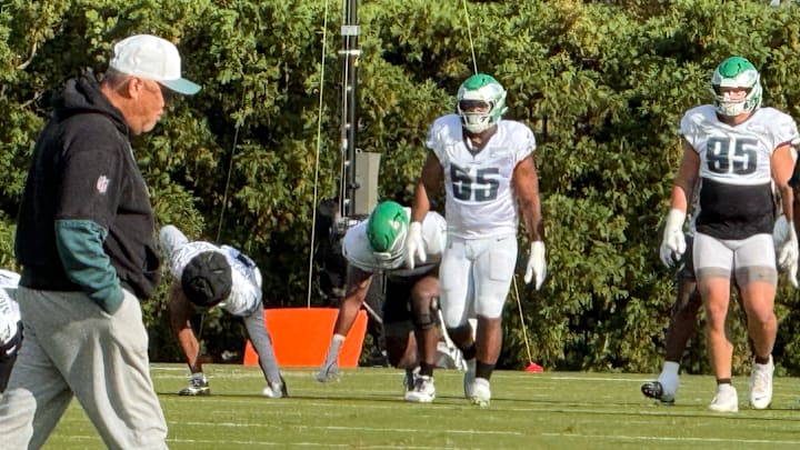 Eagles defensive coordinator Vic Fangio takes the practice field as Brandon Graham (55) goes through his first practice after unretiring. 