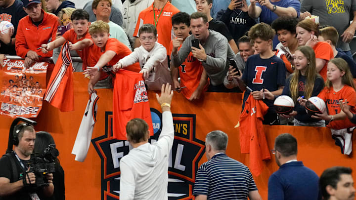 Fans cheer for Illinois Fighting Illini head coach Brad Underwood as he leaves the court following practice ahead of a Final Four game on Friday, April 3, 2026, at Lucas Oil Stadium in Indianapolis.