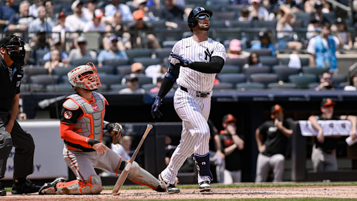 Jun 21, 2025; Bronx, New York, USA; New York Yankees catcher J.C. Escarra (25) hits a solo home run against the Baltimore Orioles during the second inning at Yankee Stadium. Mandatory Credit: John Jones-Imagn Images