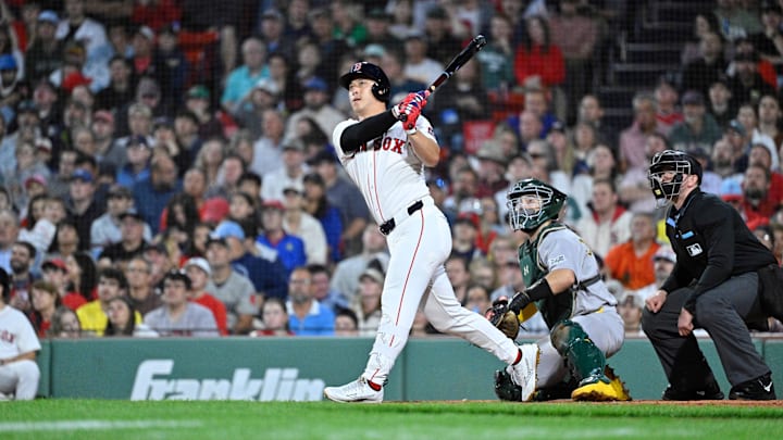 Sep 17, 2025; Boston, Massachusetts, USA; Boston Red Sox right fielder Rob Refsnyder (30) hits a one run home run against the Athletics during the second inning at Fenway Park. Mandatory Credit: Eric Canha-Imagn Images