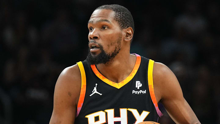 Apr 3, 2024; Phoenix, Arizona, USA; Phoenix Suns forward Kevin Durant (35) controls the ball against Cleveland. 