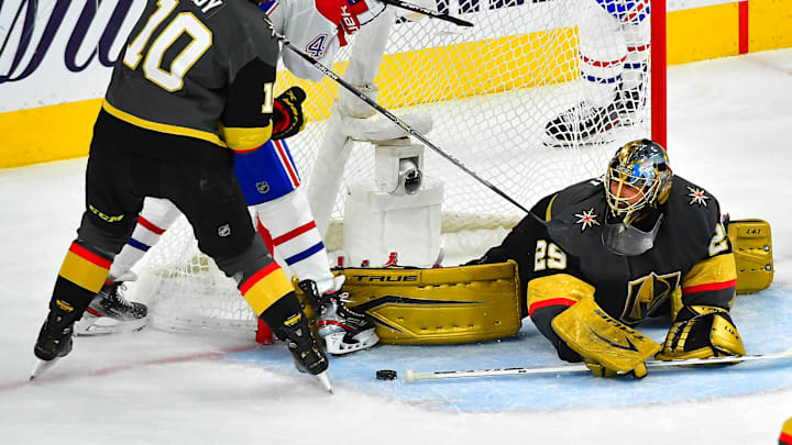 Jun 22, 2021; Las Vegas, Nevada, USA; Vegas Golden Knights center Nicolas Roy (10) checks Montreal Canadiens right wing Joel Armia (40) as goaltender Marc-Andre Fleury (29) keeps the puck out of his net during the second period of game five of the 2021 Stanley Cup Semifinals at T-Mobile Arena. Mandatory Credit: Stephen R. Sylvanie-Imagn Images Jun 22, 2021; Las Vegas, Nevada, USA; Vegas Golden Knights center Nicolas Roy (10) checks Montreal Canadiens right wing Joel Armia (40) as goaltender Marc-Andre Fleury (29) keeps the puck out of his net during the second period of game five of the 2021 Stanley Cup Semifinals at T-Mobile Arena. Mandatory Credit: Stephen R. Sylvanie-Imagn Images