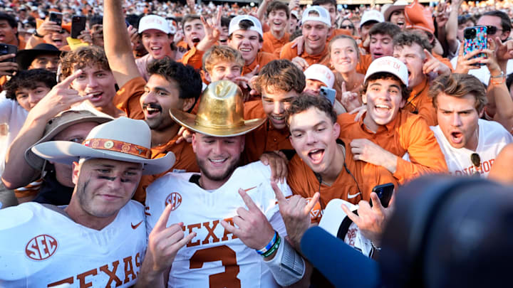 Texas Longhorns quarterback Quinn Ewers (3) and Michael Taaffe (16) celebrate following the Red River Rivalry college football game between the University of Oklahoma Sooners and the Texas Longhorn at the Cotton Bowl Stadium in Dallas, Texas, Saturday, Oct., 12, 2024.