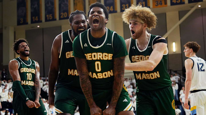 George Mason Patriots forward Jalen Haynes (11), guard K.D. Johnson (0), and guard Brayden O'Connor (4)