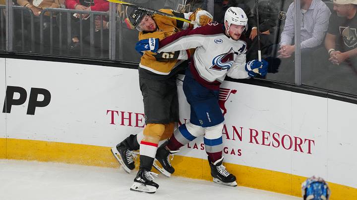 May 26, 2026; Las Vegas, Nevada, USA; Colorado Avalanche defenseman Cale Makar (8) defends against Vegas Golden Knights center Brett Howden (21) during the third period in game four of the Western Conference Final of the 2026 Stanley Cup Playoffs at T-Mobile Arena. Mandatory Credit: Stephen R. Sylvanie-Imagn Images