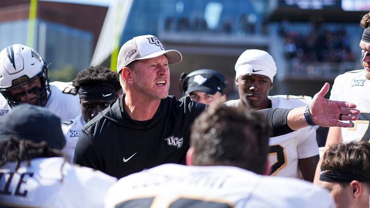 Oct 11, 2025; Cincinnati, Ohio, USA; UCF Knights head coach Scott Frost talks with his team on the sidelines in the game against the Cincinnati Bearcats in the second half at Nippert Stadium. Mandatory Credit: Aaron Doster-Imagn Images Oct 11, 2025; Cincinnati, Ohio, USA; UCF Knights head coach Scott Frost talks with his team on the sidelines in the game against the Cincinnati Bearcats in the second half at Nippert Stadium. Mandatory Credit: Aaron Doster-Imagn Images