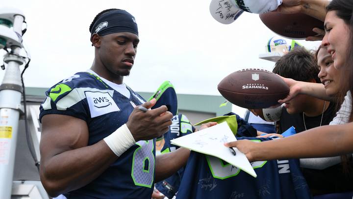 Seattle Seahawks running back Jadarian Price interacts with fans after the first training camp. Seattle Seahawks running back Jadarian Price interacts with fans after the first training camp.
