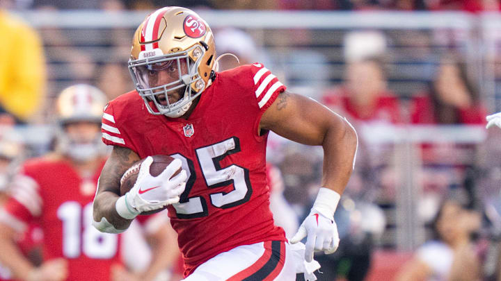 September 21, 2023; Santa Clara, California, USA; San Francisco 49ers running back Elijah Mitchell (25) carries the football during the second quarter against the New York Giants at Levi's Stadium. Mandatory Credit: Kyle Terada-Imagn Images