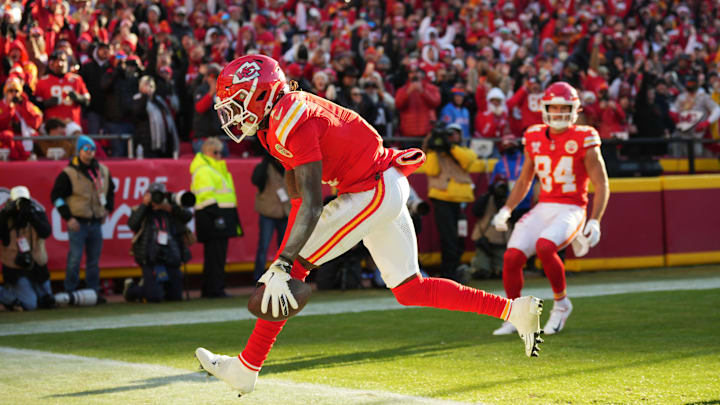 Dec 21, 2024; Kansas City, Missouri, USA; Kansas City Chiefs wide receiver Xavier Worthy (1) scores a touchdown  during the second half against the Houston Texans at GEHA Field at Arrowhead Stadium. Mandatory Credit: Jay Biggerstaff-Imagn Images