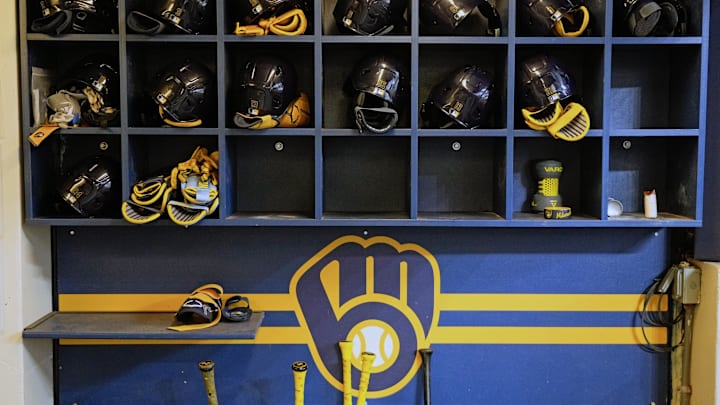 Apr 5, 2025; Milwaukee, Wisconsin, USA;  General view of Milwaukee Brewers batting helmets in the dugout prior to the game against the Cincinnati Reds at American Family Field. Mandatory Credit: Jeff Hanisch-Imagn Images