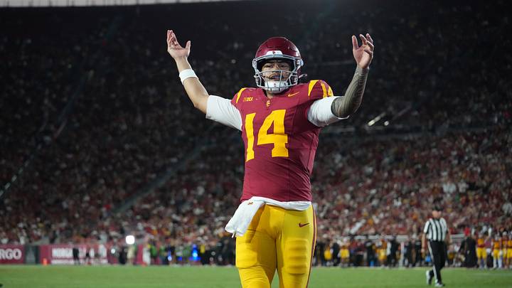 Sep 4, 2026; Los Angeles, California, USA; Southern California Trojans quarterback Jayden Maiava (14) celebrates after a touchdown against the Fresno State Bulldogs in the first half at United Airlines Field at Los Angeles Memorial Coliseum. Mandatory Credit: Kirby Lee-Imagn Images