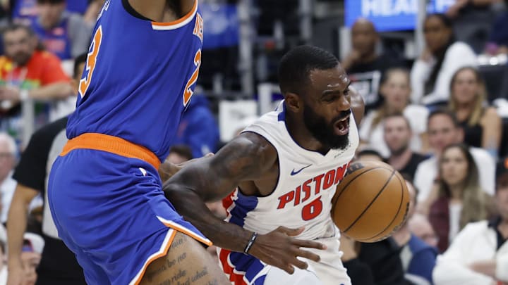 Apr 24, 2025; Detroit, Michigan, USA; Detroit Pistons forward Tim Hardaway Jr. (8) is defended by New York Knicks center Mitchell Robinson (23) in the second half during game three of first round for the 2024 NBA Playoffs at Little Caesars Arena. Mandatory Credit: Rick Osentoski-Imagn Images