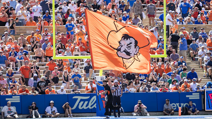 Sep 14, 2024; Tulsa, Oklahoma, USA; The Oklahoma State Cowboys flag is flown in the end zone after a score against the Tulsa Golden Hurricane during the third quarter at Skelly Field at H.A. Chapman Stadium. Mandatory Credit: Brett Rojo-Imagn Images Sep 14, 2024; Tulsa, Oklahoma, USA; The Oklahoma State Cowboys flag is flown in the end zone after a score against the Tulsa Golden Hurricane during the third quarter at Skelly Field at H.A. Chapman Stadium. Mandatory Credit: Brett Rojo-Imagn Images