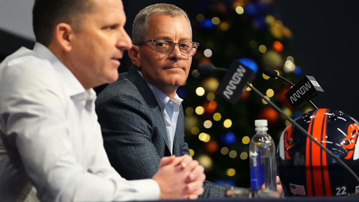 Dec 27, 2022; Englewood, CO, USA; Denver Broncos CEO Greg Penner listens as general manager George Payton speaks at the UCHealth Training Center. Mandatory Credit: Ron Chenoy-Imagn Images