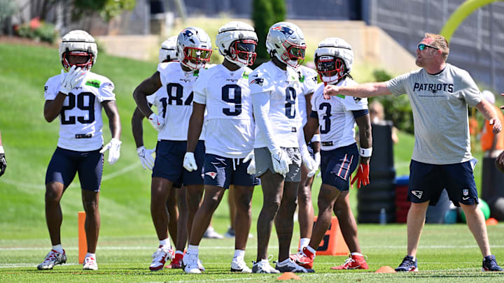 Jul 23, 2025; Foxborough, MA, USA; New England Patriots wide receiver Jeremiah Webb (29), wide receiver Kendrick Bourne (84), wide receiver Kayshon Boutte (9), wide receiver Stefon Diggs (8) and wide receiver DeMario Douglas (3) work with the coaching staff to do a drill during training camp at Gillette Stadium. Mandatory Credit: Eric Canha-Imagn Images