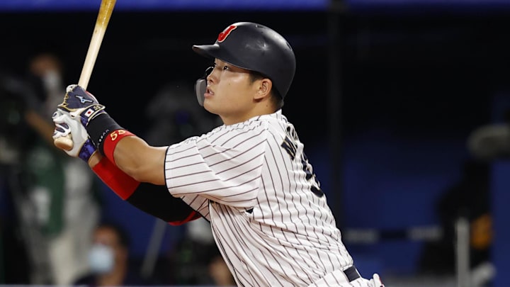 Aug 7, 2021; Yokohama, Japan; Team Japan infielder Munetaka Murakami (55) hits a solo home run against USA during the third inning in the baseball gold medal match during the Tokyo 2020 Olympic Summer Games at Yokohama Baseball Stadium. Mandatory Credit: Yukihito Taguchi-Imagn Images