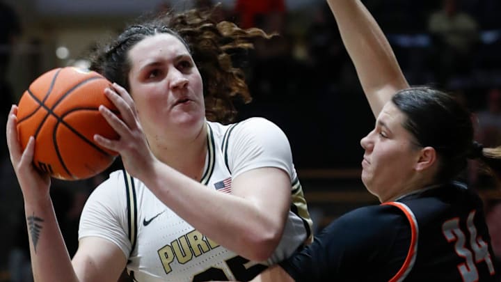 Purdue Boilermakers forward Lana McCarthy (35) is defended by Indiana Tech Warriors center Lauren Barton (34) Purdue Boilermakers forward Lana McCarthy (35) is defended by Indiana Tech Warriors center Lauren Barton (34)