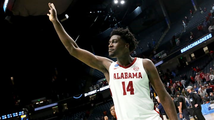 Alabama center Charles Bediako (14) gestures as he leaves the court at Legacy Arena in Birmingham, Alabama, during the second round of the NCAA Tournament on March 18, 2023.