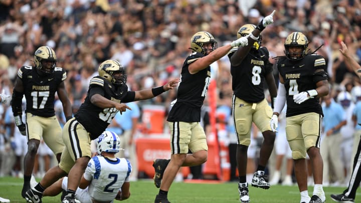 Purdue Boilermakers defensive end Will Heldt (15) and defensive end CJ Madden (8) celebrate Purdue Boilermakers defensive end Will Heldt (15) and defensive end CJ Madden (8) celebrate