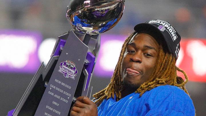 Ashton Jeanty hoists the Mountain West trophy in 2024. Ashton Jeanty hoists the Mountain West trophy in 2024.