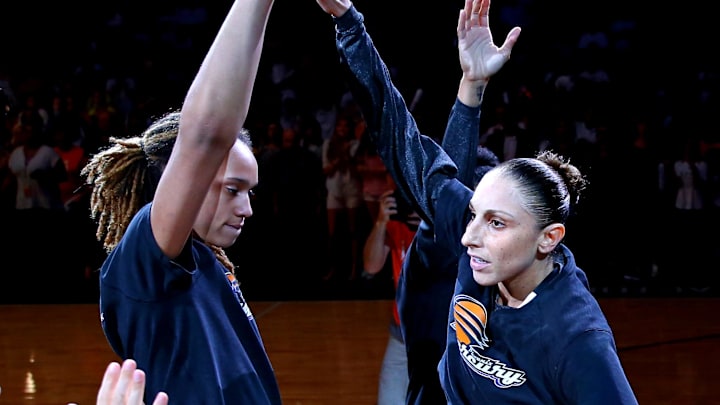 Sep 9, 2014; Phoenix, AZ, USA; Phoenix Mercury guard Diana Taurasi (right) high fives center Brittney Griner prior to the game against the Chicago Sky during game two of the WNBA Finals at US Airways Center. The Mercury defeated the Sky 97-68. Mandatory Credit: Mark J. Rebilas-Imagn Images