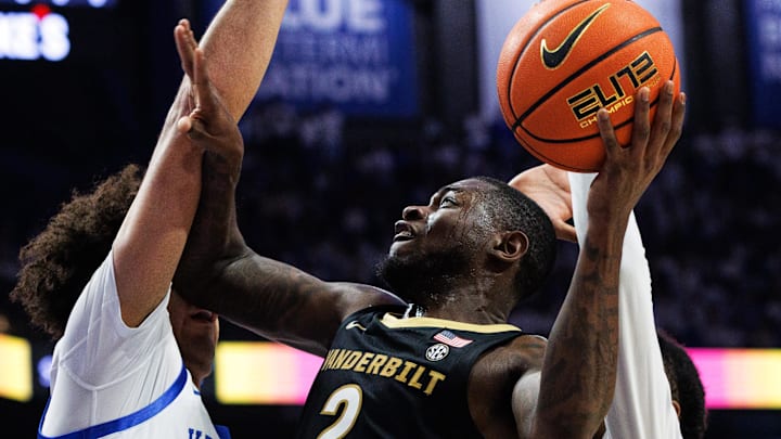 Feb 28, 2026; Lexington, Kentucky, USA; Vanderbilt Commodores guard Duke Miles (2) goes to the basket against Kentucky Wildcats center Malachi Moreno (24) during the first half at Rupp Arena at Central Bank Center. Mandatory Credit: Jordan Prather-Imagn Images