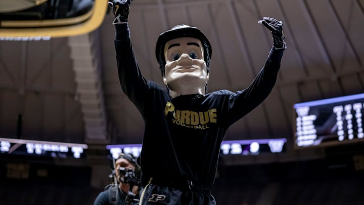 Purdue Pete fires up the crowd during an NCAA volleyball match 