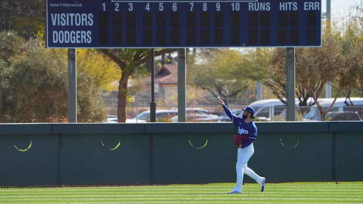 Feb 15, 2025; Glendale, AZ, USA; Los Angeles Dodgers pitcher Tony Gonsolin (26) throws during a Spring Training workout at Camelback Ranch. Mandatory Credit: Joe Camporeale-Imagn Images