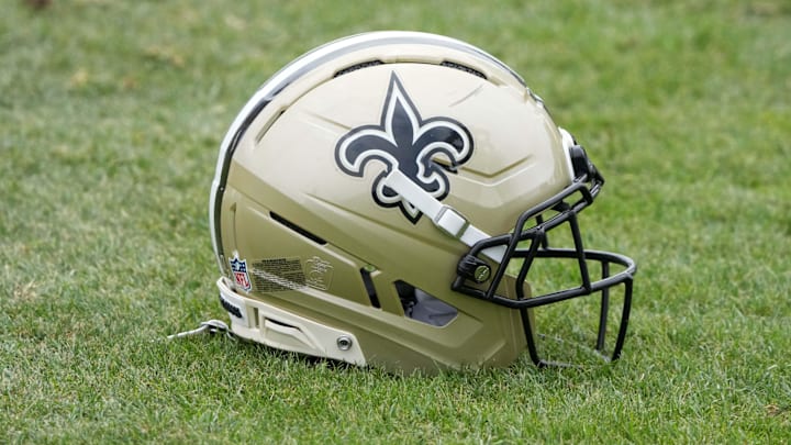 Aug 14, 2025; Carson, CA, USA; A New Orleans Saints helmet on the field during a joint practice against the Los Angeles Rams at the Dignity Health Sports Park. Mandatory Credit: Kirby Lee-Imagn Images