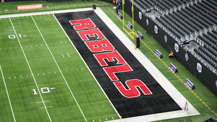 The UNLV Rebels logo in the end zone is seen before the Mountain West Championship between the Boise State Broncos and the UNLV Rebels at Allegiant Stadium. Mandatory Credit: Kirby Lee-Imagn Images The UNLV Rebels logo in the end zone is seen before the Mountain West Championship between the Boise State Broncos and the UNLV Rebels at Allegiant Stadium. Mandatory Credit: Kirby Lee-Imagn Images