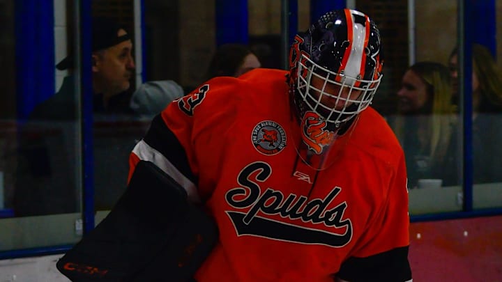 Moorhead senior Charlie Stenehjem plays the puck outside of his crease Jan. 14 during a game at Scheels Athletic Complex in Sartell. The Spuds won 3-0.