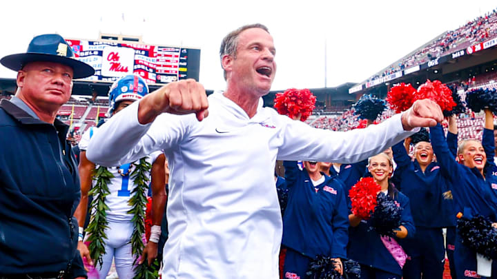 Oct. 25, 2025; Norman, Oklahoma, USA;  Ole Miss Rebels head coach Lane Kiffin celebrates with fans after the game against the Oklahoma Sooners at Gaylord Family-Oklahoma Memorial Stadium.