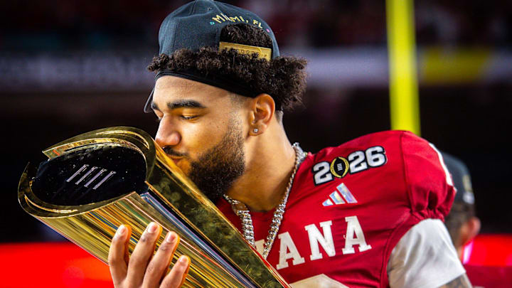 Indiana's Elijah Sarratt (13) kisses the trophy after the College Football Playoff National Championship college football game at Hard Rock Stadium in Miami Gardens on Monday, Jan. 19, 2026.
