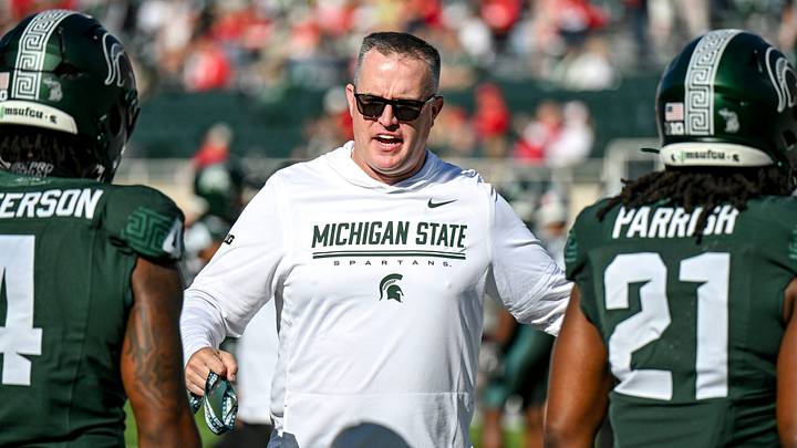 Michigan State’s head coach Pat Fitzgerald, center, talks with Jaziun Patterson, left, and Marvis Parrish before the football game against Nebraska on Saturday, Sept. 26, 2026, in East Lansing.