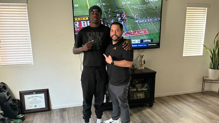 Maxwell Miles with Gophers defensive coordinator Danny Collins during an in-home visit. Maxwell Miles with Gophers defensive coordinator Danny Collins during an in-home visit.