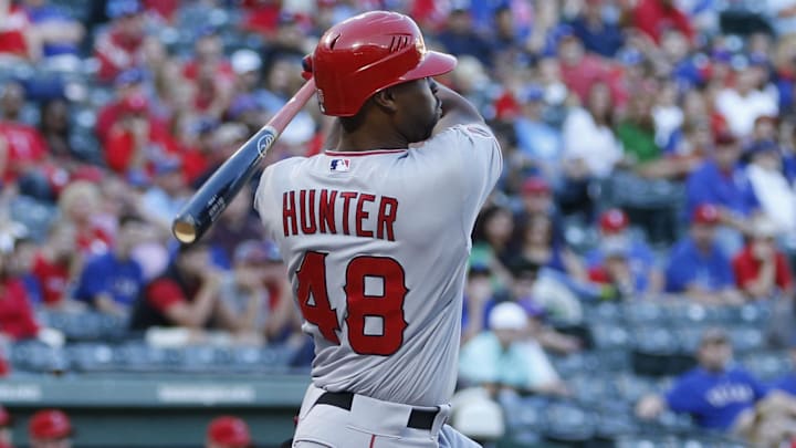 September 30, 2012; Arlington, TX, USA; Los Angeles Angels right fielder Torii Hunter (48) singles in a run against the Texas Rangers in the first inning at Rangers Ballpark in Arlington. Mandatory Credit: Jim Cowsert-Imagn Images